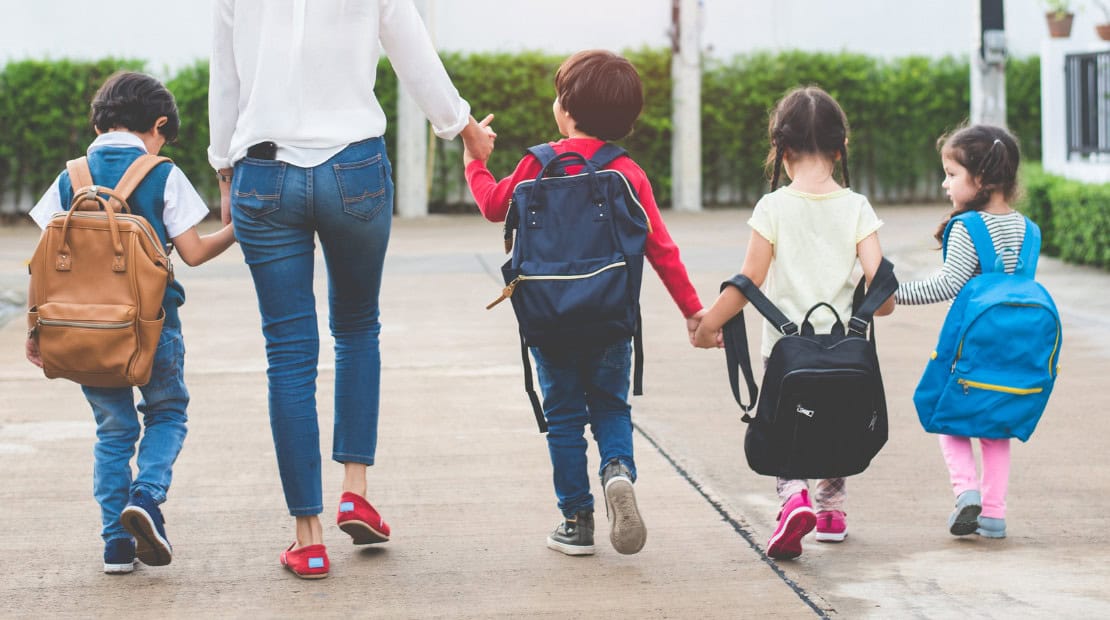 mom walking kids to school